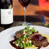 Lamb shoulder with green pea, feta, pine nut and mint salsa, pinot jus and quince jelly