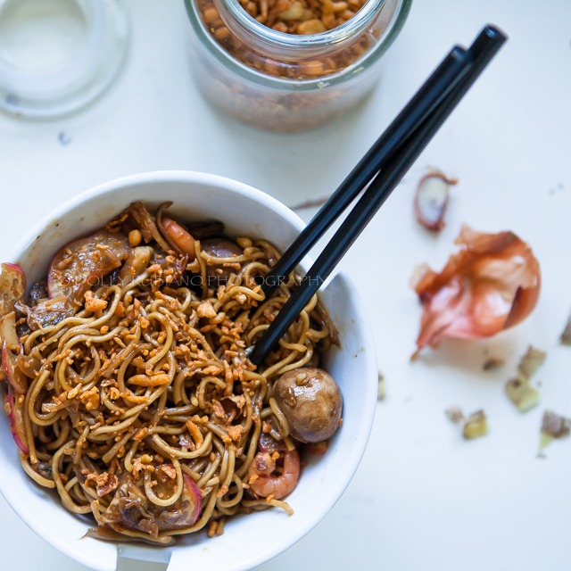 Sweet and spicy stir-fried noodles with seafood, mushrooms and radishes