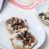 Fried mushrooms with walnuts and goat cheese on pita bread